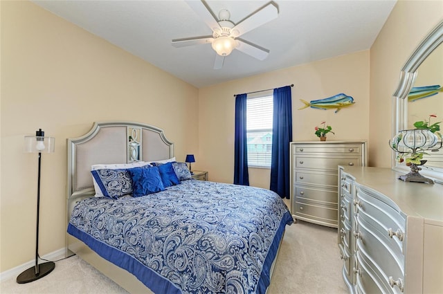 bedroom with carpet flooring, ceiling fan, and baseboards