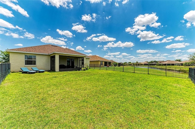 view of yard featuring a sunroom