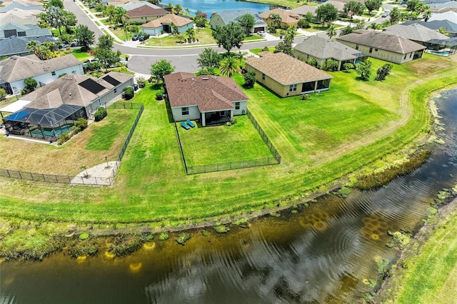 aerial view of residential area featuring a nearby body of water