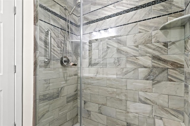 bathroom with a shower stall