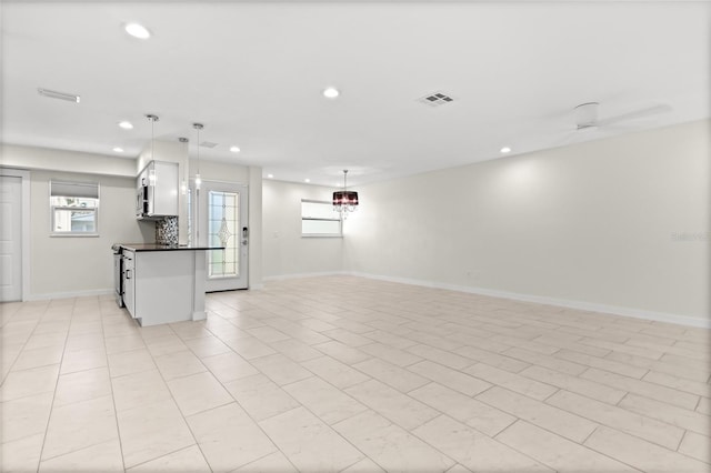 interior space featuring visible vents, baseboards, and recessed lighting