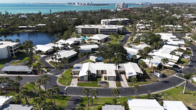 bird's eye view with a city view, a water view, and a residential view