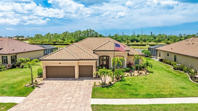 20359 Cristoforo Pl, Venice, FL 34293 - mediterranean / spanish home with an attached garage, driveway, stucco siding, and a front lawn