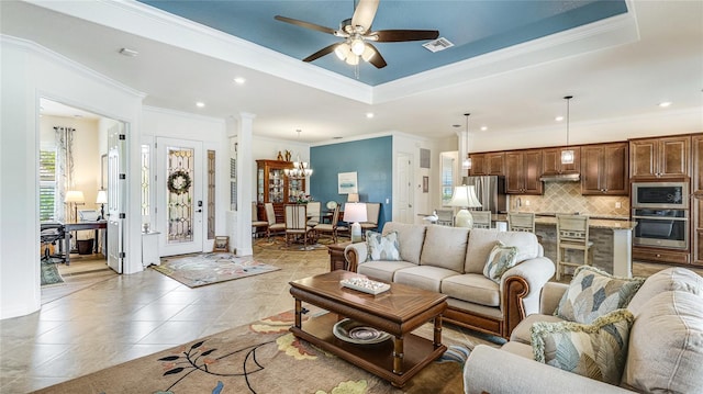 20359 Cristoforo Pl, Venice, FL 34293 - living area featuring crown molding, ceiling fan, a tray ceiling, a chandelier, and recessed lighting