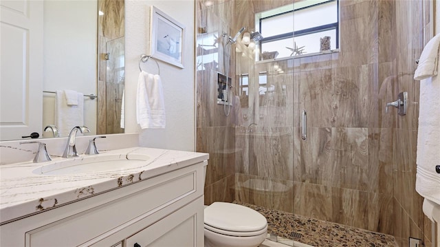 20359 Cristoforo Pl, Venice, FL 34293 - bathroom with toilet, a stall shower, and vanity