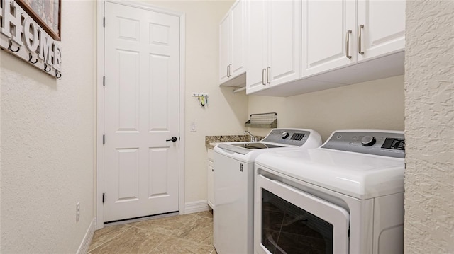 20359 Cristoforo Pl, Venice, FL 34293 - clothes washing area with washing machine and dryer, cabinet space, and baseboards