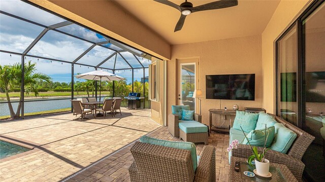 20359 Cristoforo Pl, Venice, FL 34293 - view of patio featuring a water view, a grill, outdoor dining area, glass enclosure, and an outdoor hangout area