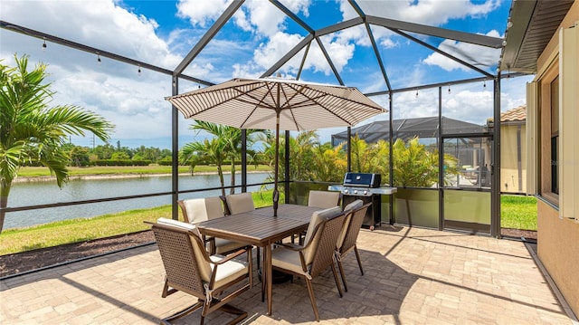 20359 Cristoforo Pl, Venice, FL 34293 - view of patio / terrace featuring grilling area, a water view, a lanai, and outdoor dining space