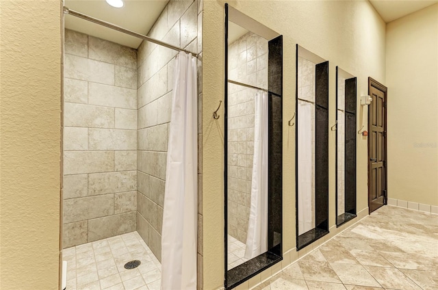 20359 Cristoforo Pl, Venice, FL 34293 - full bathroom with a stall shower, a textured wall, and recessed lighting