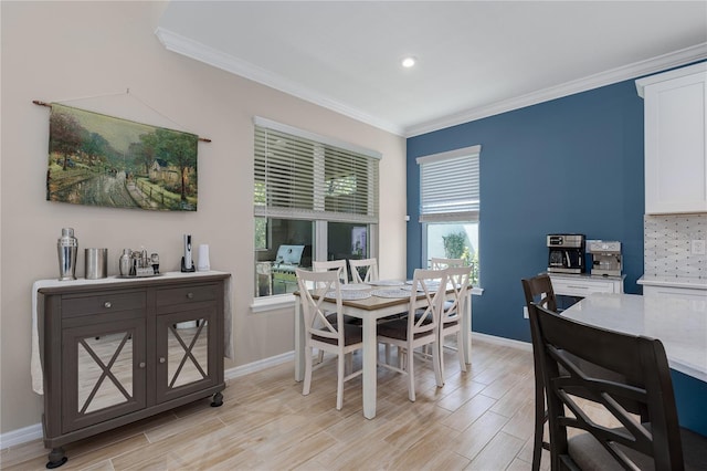 dining area with baseboards, ornamental molding, light wood finished floors, and recessed lighting