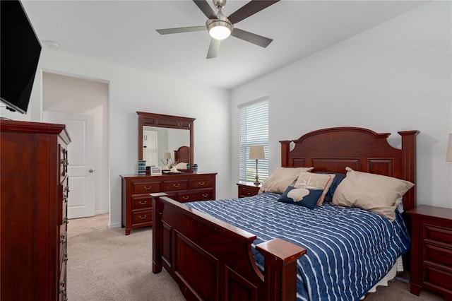 bedroom featuring a ceiling fan and light carpet
