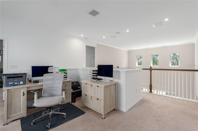 home office featuring light colored carpet, ornamental molding, and visible vents