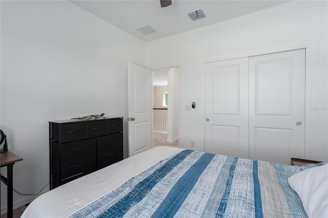 bedroom with a ceiling fan, baseboards, a closet, and visible vents