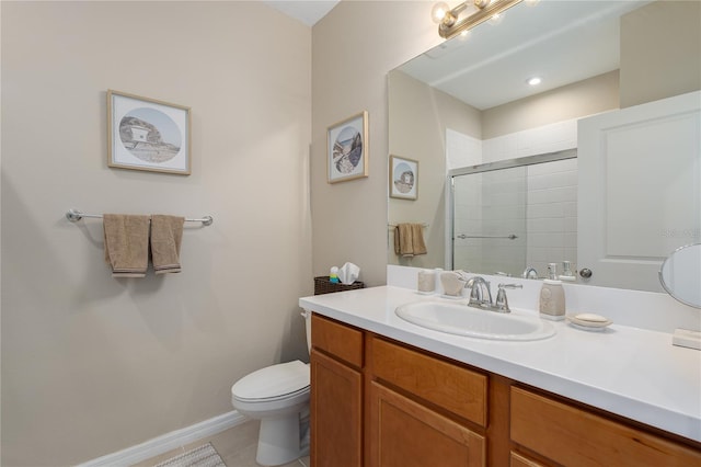 full bath featuring tile patterned floors, vanity, toilet, and a tile shower