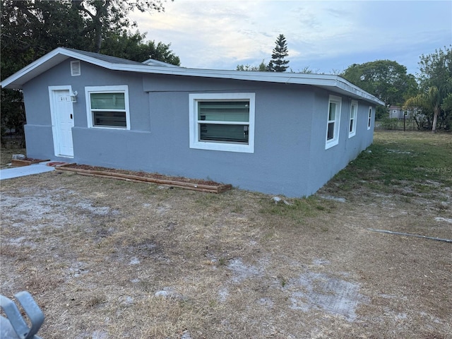 exterior space featuring stucco siding