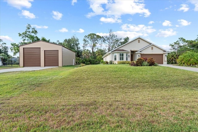 4466 Manila Ave, North Port, FL 34288 - view of front of property featuring a garage, a front yard, and an outbuilding