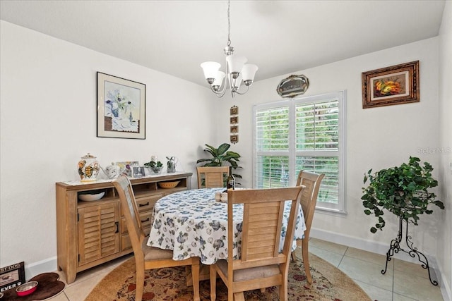4466 Manila Ave, North Port, FL 34288 - dining space with a chandelier, light tile patterned floors, and baseboards