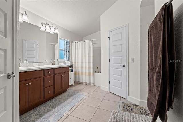 4466 Manila Ave, North Port, FL 34288 - bathroom with tile patterned flooring, shower / tub combo with curtain, lofted ceiling, double vanity, and baseboards