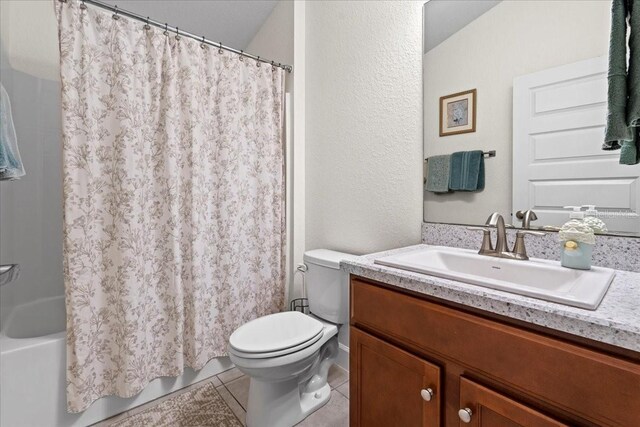 4466 Manila Ave, North Port, FL 34288 - full bathroom featuring toilet, vanity, tile patterned flooring, and shower / tub combo