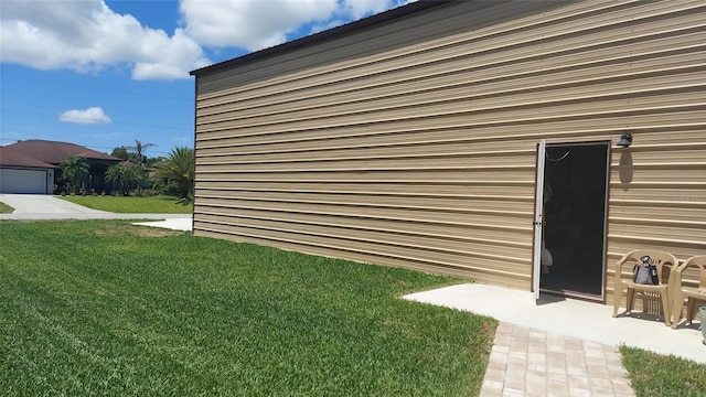 4466 Manila Ave, North Port, FL 34288 - view of side of property featuring a lawn