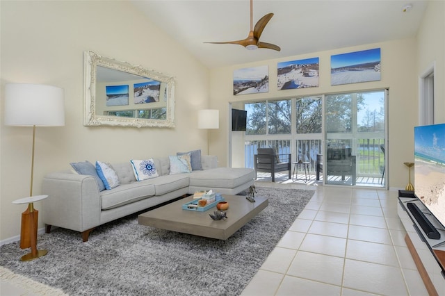 6748 Fairview Ter Unit 4-202, Bradenton, FL 34203 - living room featuring vaulted ceiling, tile patterned flooring, and a ceiling fan