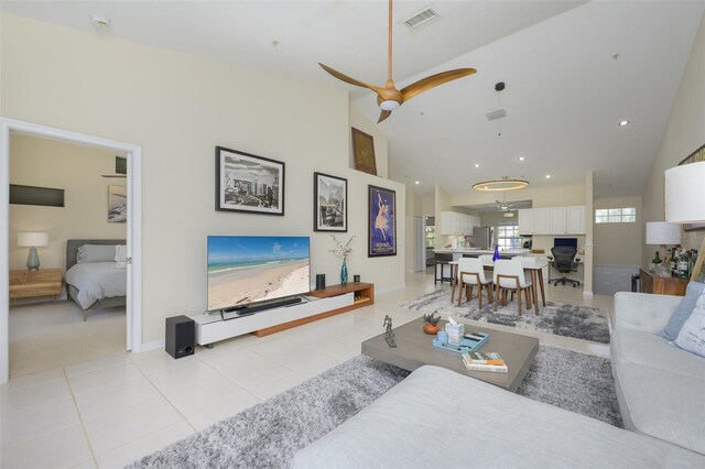 6748 Fairview Ter Unit 4-202, Bradenton, FL 34203 - living room featuring high vaulted ceiling, recessed lighting, light tile patterned floors, a ceiling fan, and baseboards