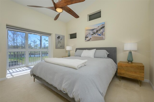 6748 Fairview Ter Unit 4-202, Bradenton, FL 34203 - bedroom with light colored carpet, access to exterior, baseboards, vaulted ceiling, and ceiling fan