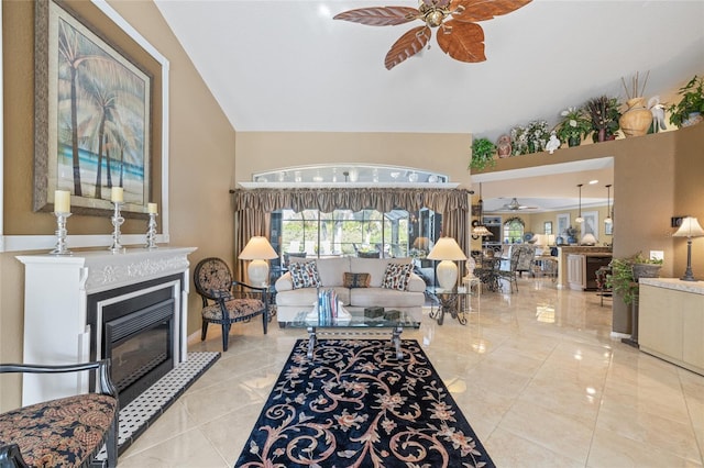 490 Pine Lily Way, Venice, FL 34293 - living room featuring a ceiling fan, a glass covered fireplace, and light tile patterned floors