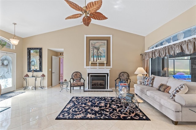 490 Pine Lily Way, Venice, FL 34293 - tiled living room with vaulted ceiling, ceiling fan, plenty of natural light, and a fireplace