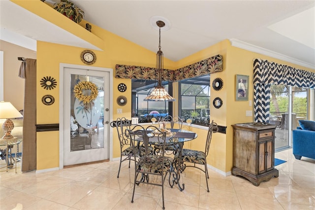 490 Pine Lily Way, Venice, FL 34293 - dining area with baseboards, vaulted ceiling, and crown molding