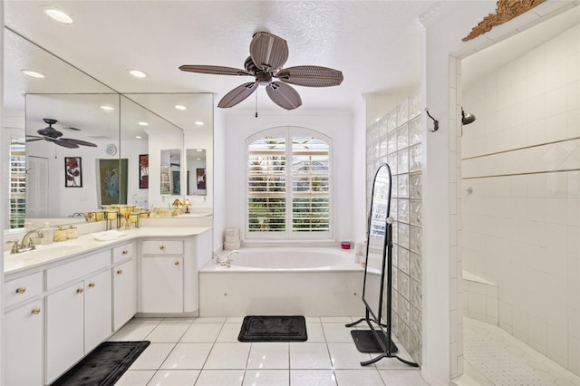 490 Pine Lily Way, Venice, FL 34293 - bathroom featuring ceiling fan, a garden tub, a walk in shower, vanity, and tile patterned floors
