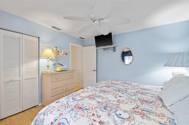 490 Pine Lily Way, Venice, FL 34293 - bedroom featuring a closet, light wood finished floors, and a ceiling fan