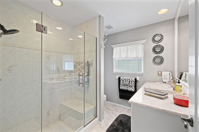 490 Pine Lily Way, Venice, FL 34293 - full bath with a stall shower, toilet, vanity, marble look tiles, and recessed lighting