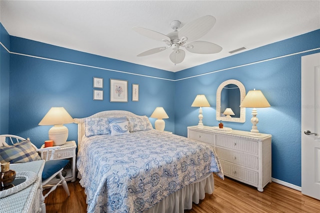 490 Pine Lily Way, Venice, FL 34293 - bedroom with wood finished floors, baseboards, and a ceiling fan