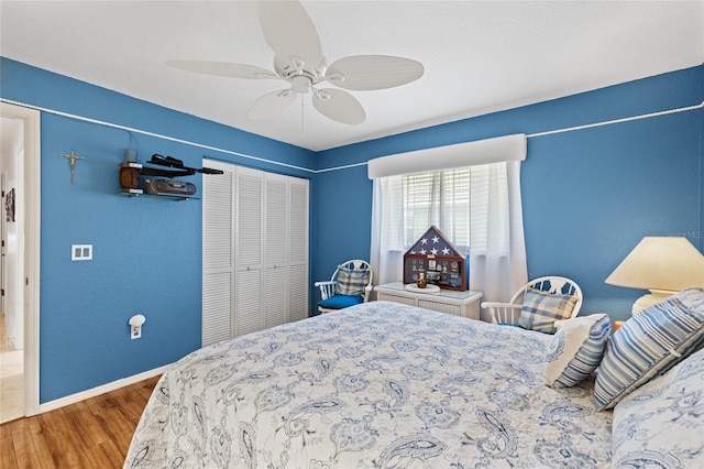 490 Pine Lily Way, Venice, FL 34293 - bedroom featuring wood finished floors, baseboards, a closet, and ceiling fan