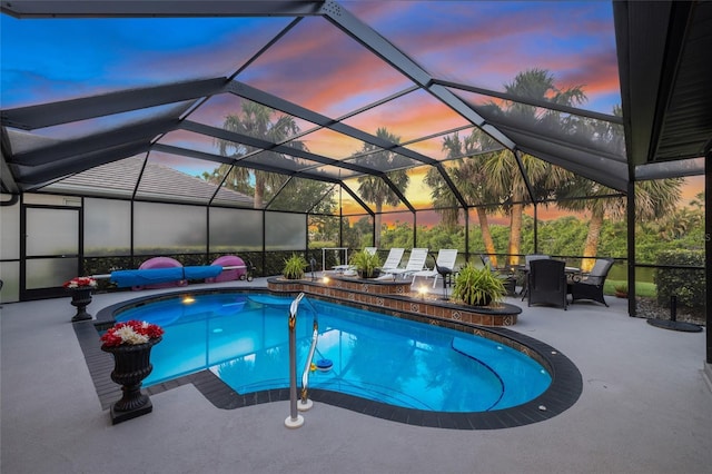 490 Pine Lily Way, Venice, FL 34293 - pool at dusk featuring a patio area, an outdoor pool, outdoor dining area, and glass enclosure
