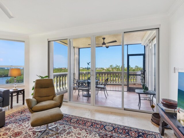 sunroom / solarium featuring crown molding and plenty of natural light