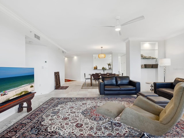 living room featuring crown molding, ceiling fan, and a water view