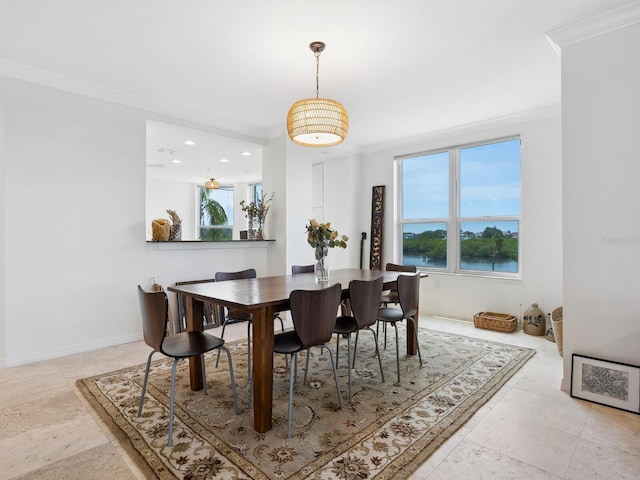 dining room featuring ornamental molding, healthy amount of natural light, recessed lighting, and baseboards