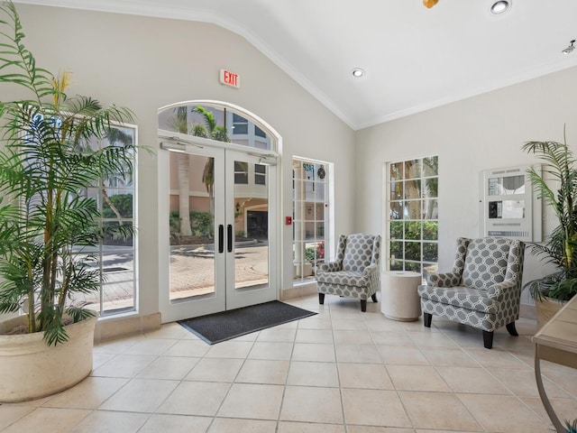 doorway with lofted ceiling, french doors, light tile patterned floors, crown molding, and recessed lighting