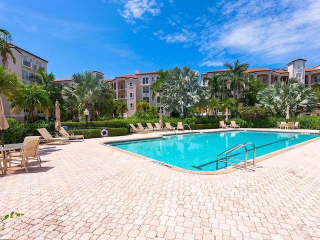 community pool featuring a patio area
