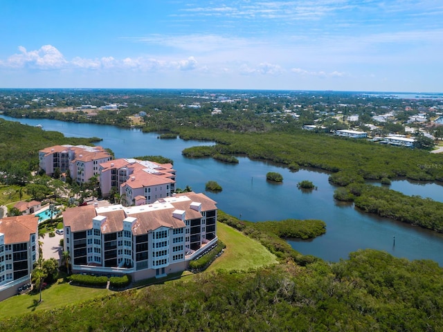 bird's eye view of a nearby body of water and apartment complex