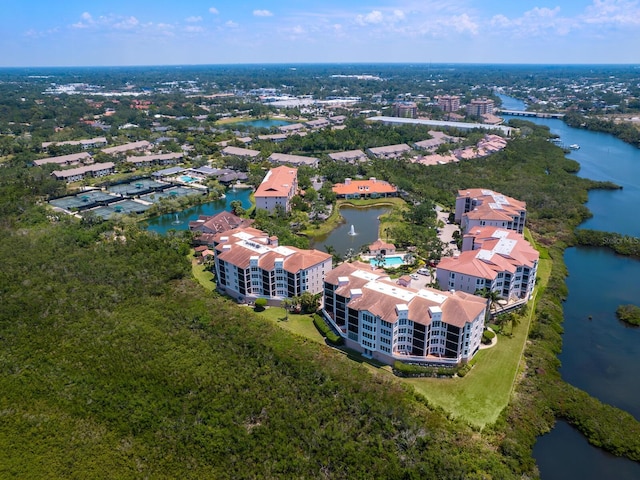 bird's eye view of a large body of water and apartment complex