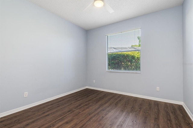 4063 Westbourne Cir, Sarasota, FL 34238 - unfurnished room with dark wood-type flooring, baseboards, and ceiling fan