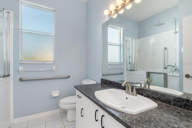 4063 Westbourne Cir, Sarasota, FL 34238 - full bathroom with tile patterned floors, walk in shower, toilet, baseboards, and vanity