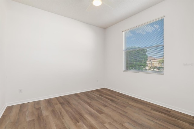 4063 Westbourne Cir, Sarasota, FL 34238 - unfurnished room with wood finished floors, ceiling fan, and baseboards