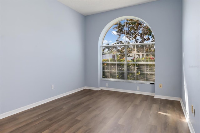 4063 Westbourne Cir, Sarasota, FL 34238 - unfurnished room featuring dark wood-type flooring and baseboards