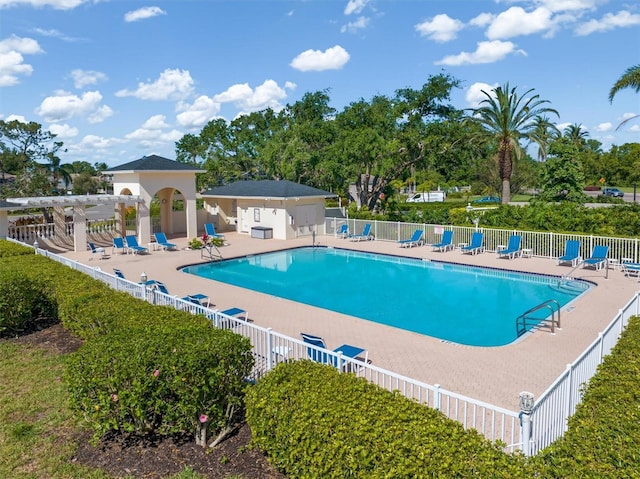 4063 Westbourne Cir, Sarasota, FL 34238 - community pool featuring fence, a patio area, and a pergola