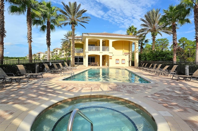 6465 Watercrest Way Unit 404, Lakewood Ranch, FL 34202 - community pool featuring a hot tub, fence, and a patio area