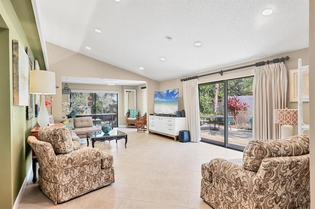 living room with plenty of natural light, lofted ceiling, light tile patterned floors, and recessed lighting